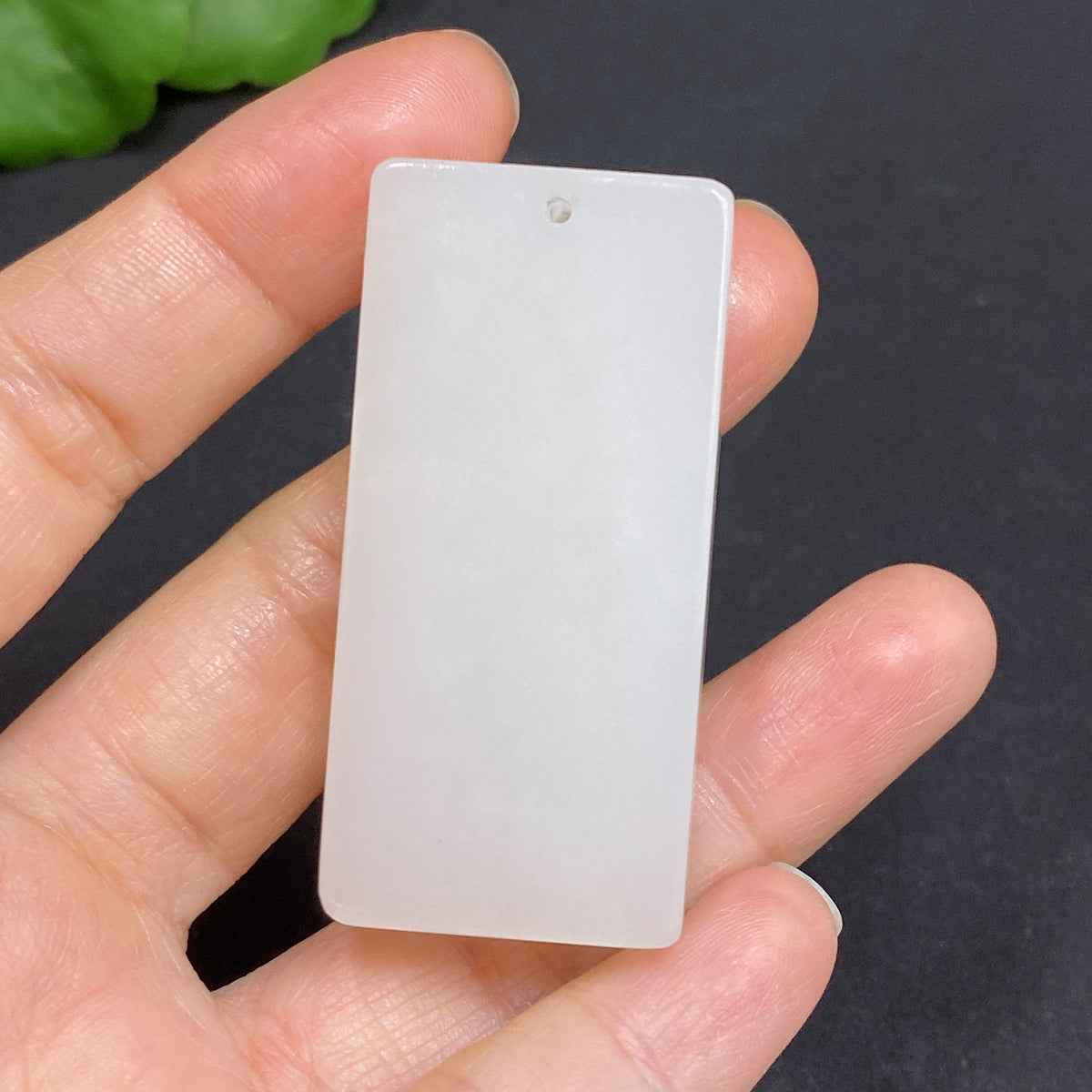Huiliu certified Hetian jade pendant with a plain, smooth jade surface, showcasing elegant, natural gemstone craftsmanship.