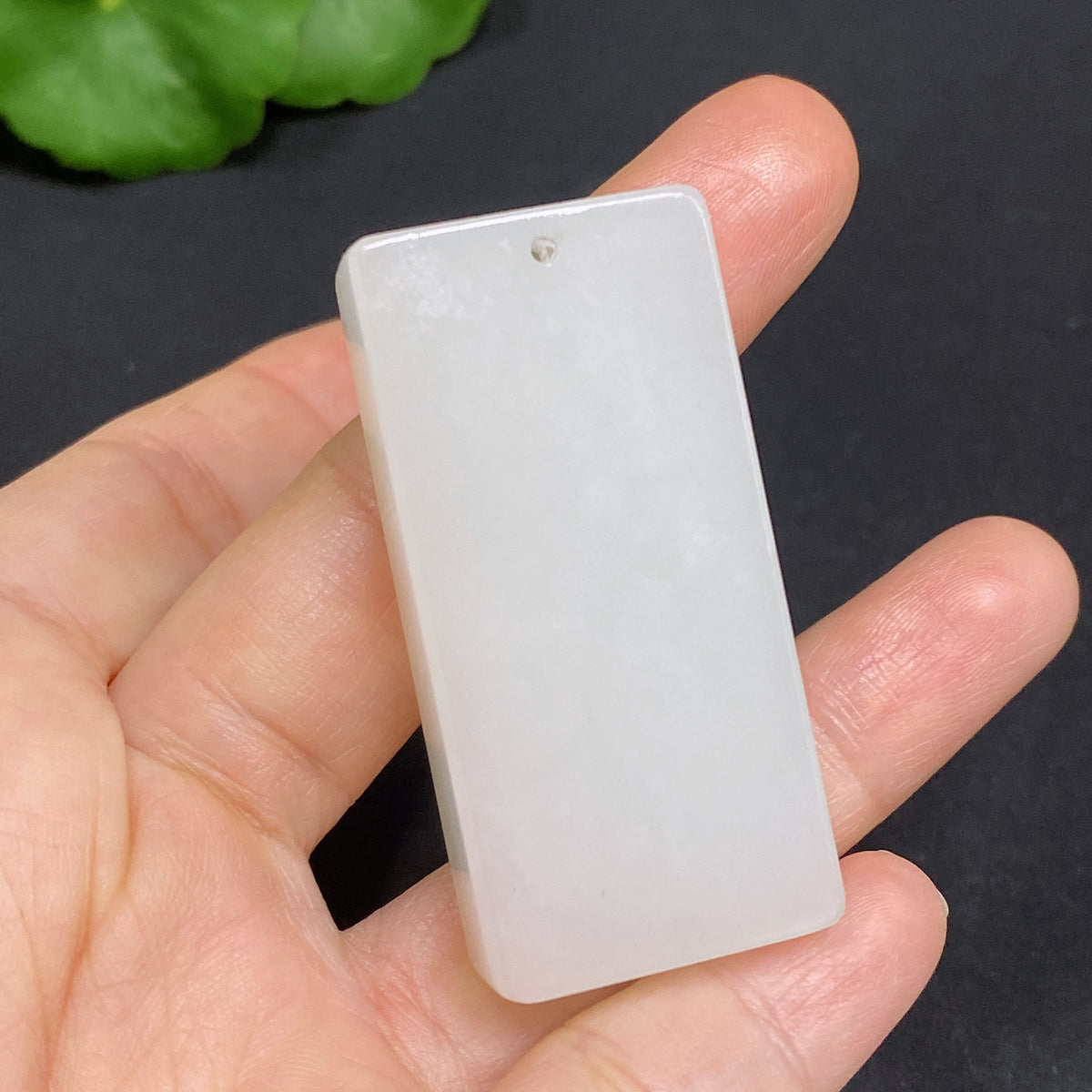 Huiliu Certified Hetian Jade Pendant in plain design, showcasing smooth, polished white jade with subtle natural variations.