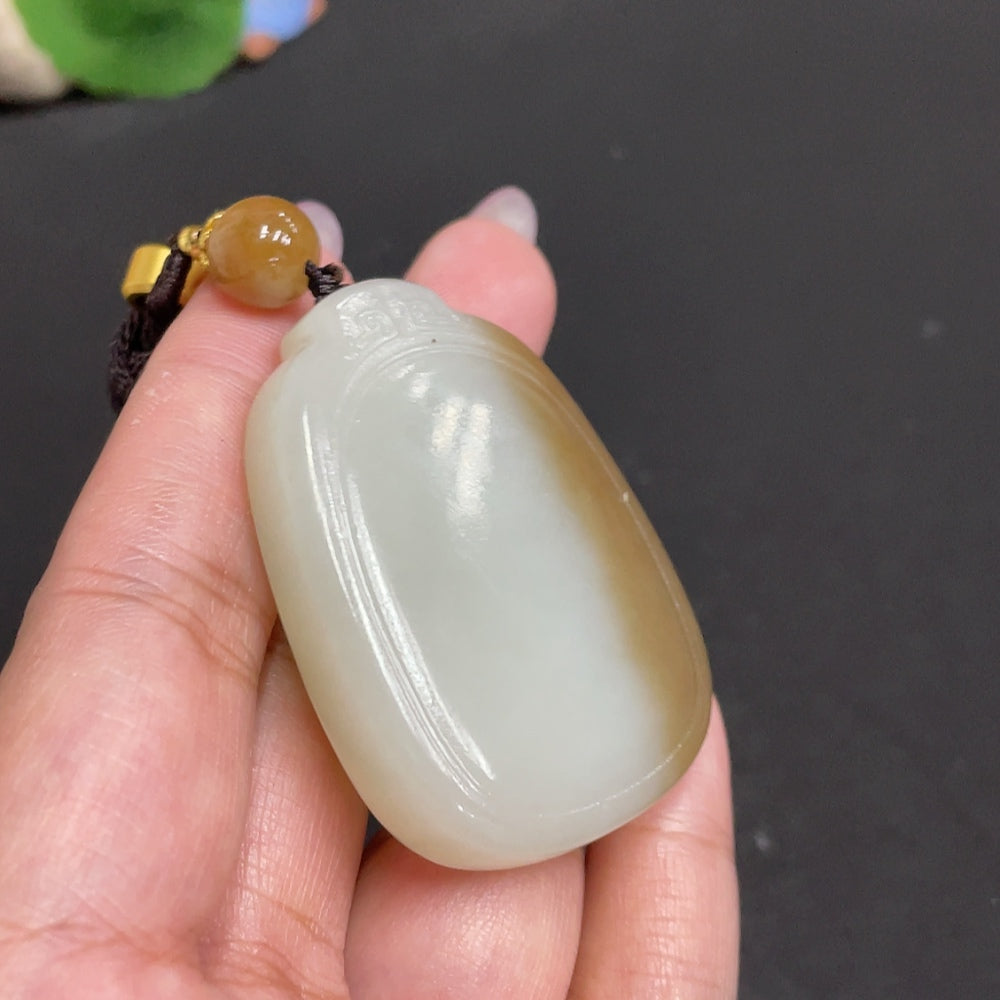 Huiliu certified Hetian jade pendant featuring a plain, smooth jade stone with natural green hues, pendant necklace design.
