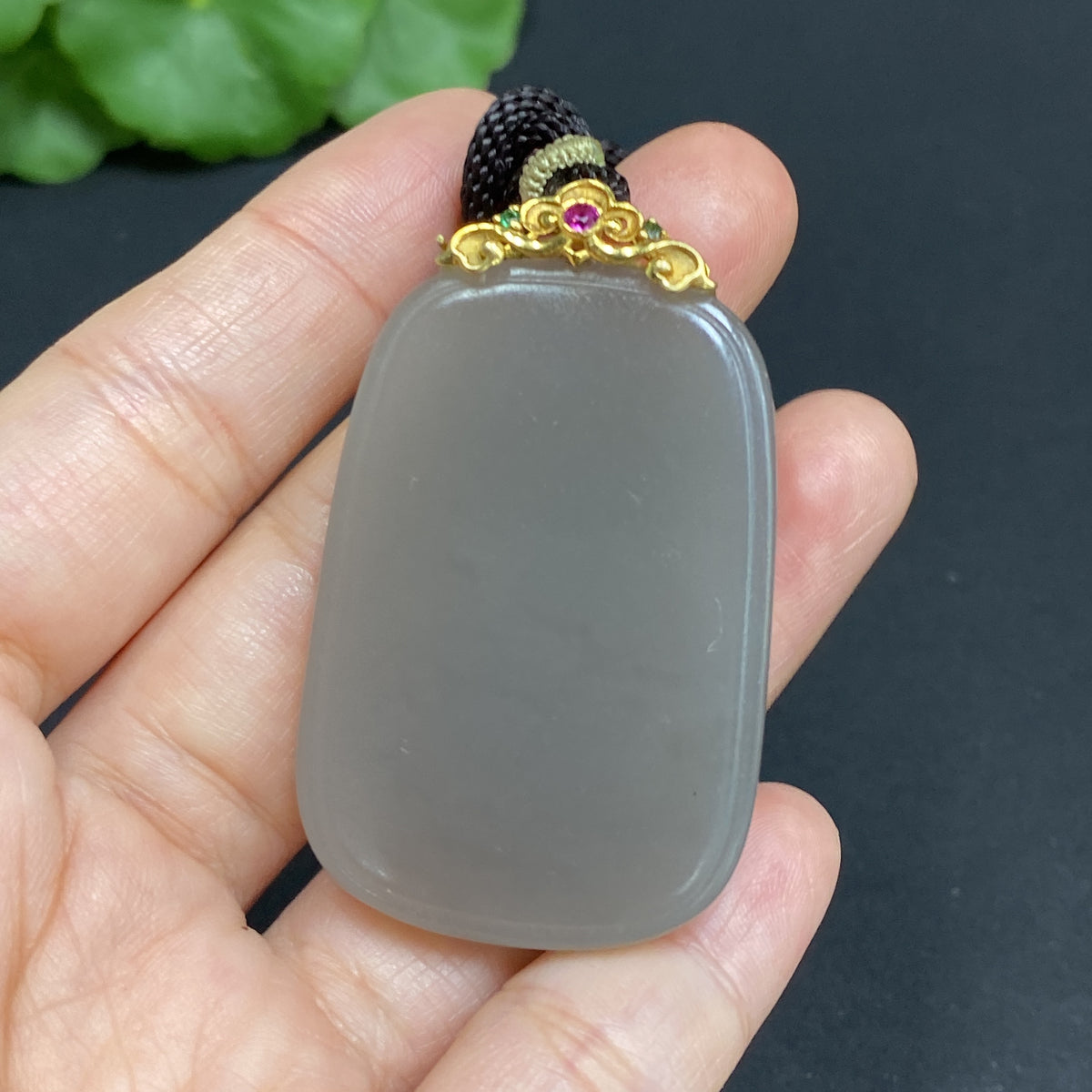Huiliu certified Hetian jade pendant with plain design, clasp, and included rope for elegant jewelry wear.