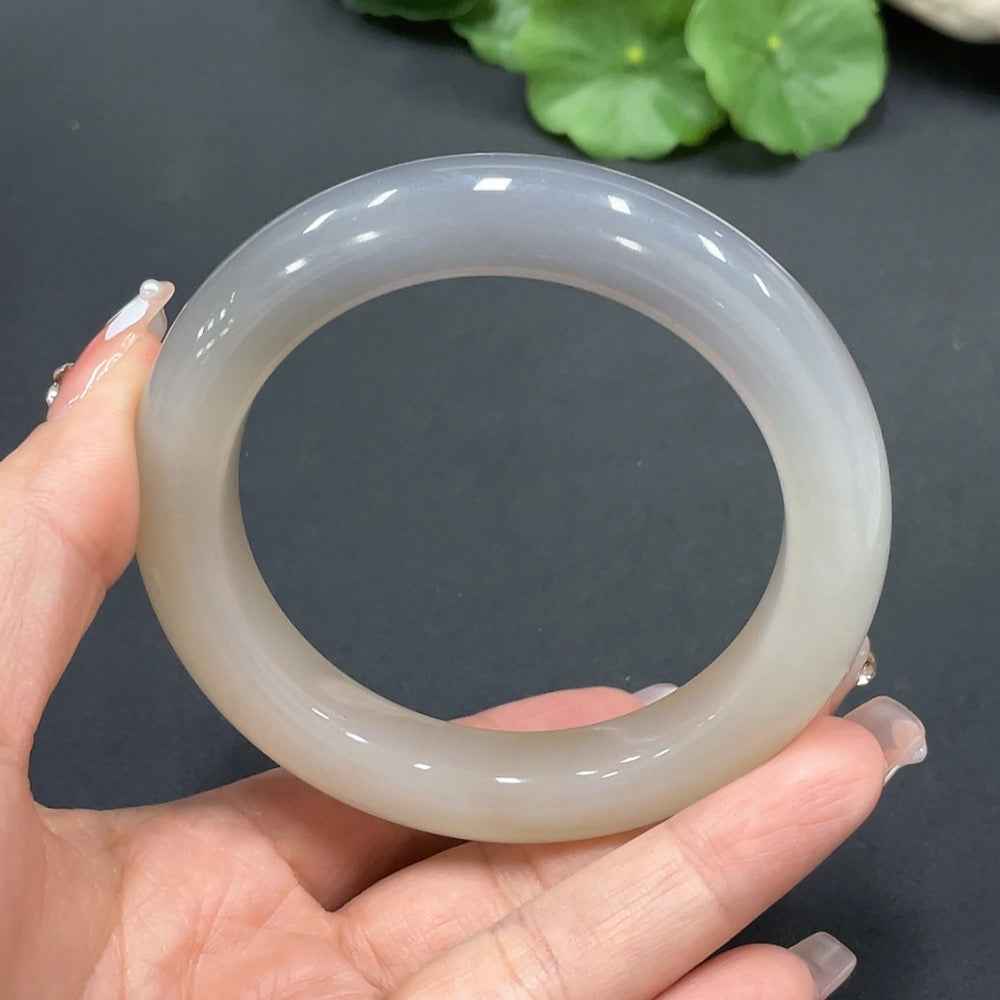 Huiliu Certified Hetian Jade Round Bracelet featuring smooth polished jade beads on a delicate string.