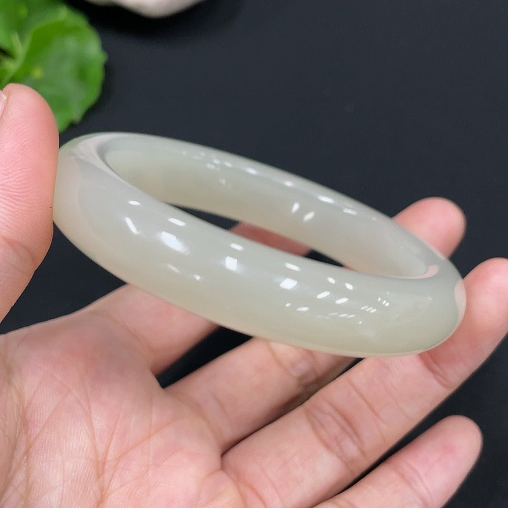 Huiliu Certified Hetian Jade round bracelet featuring smooth, polished jade beads on a delicate string.