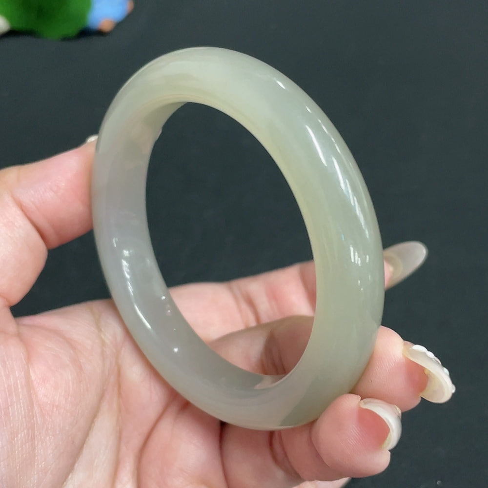 Huiliu Certified Hetian Jade round bracelet featuring smooth, polished jade beads, showcasing elegant craftsmanship and natural stone beauty.