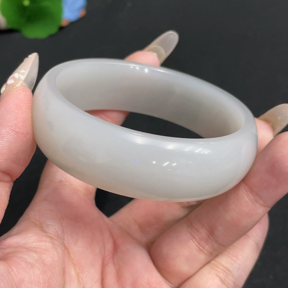 Huiliu certified Hetian Jade round bracelet featuring smooth, polished jade beads on a delicate string.