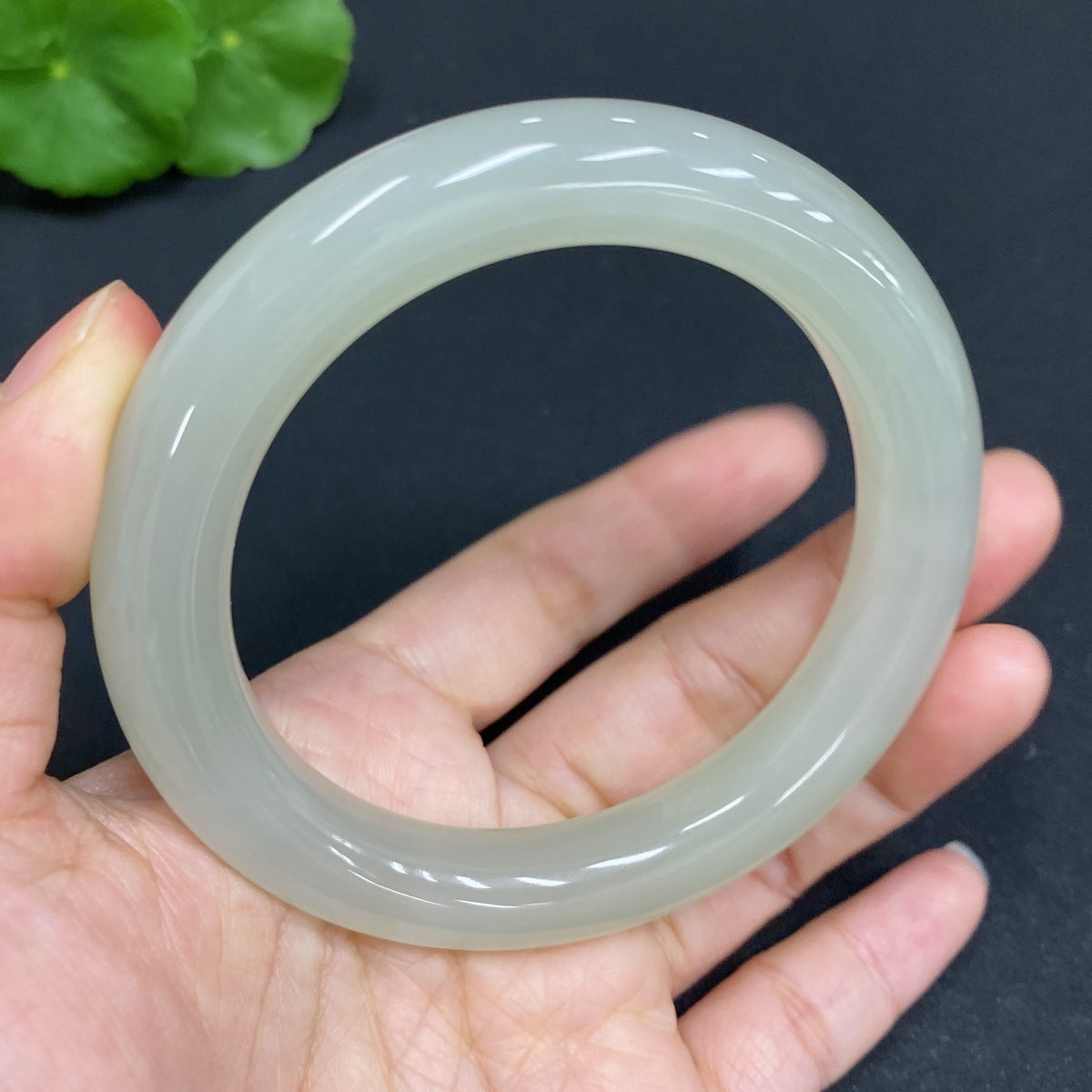 Huiliu Certified Hetian Jade Round Bracelet featuring smooth, polished green jade beads on a delicate string.
