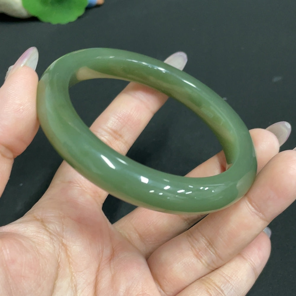 Huiliu Certified Hetian Jade round bracelet featuring smooth, polished green jade beads on a delicate string.