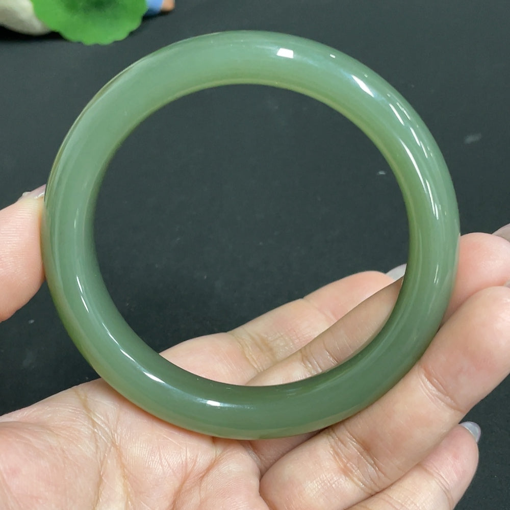 Huiliu Certified Hetian Jade round bracelet featuring smooth, polished jade beads on a delicate string, natural and elegant design.