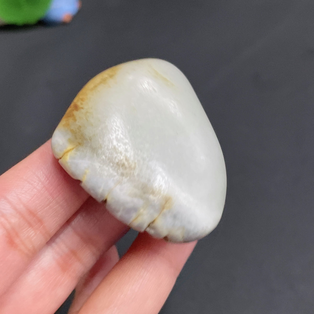 Huiliu HQ Hetian Jade with undetermined skin color, weighing approximately 51.1g, showcasing smooth, polished jade surface.