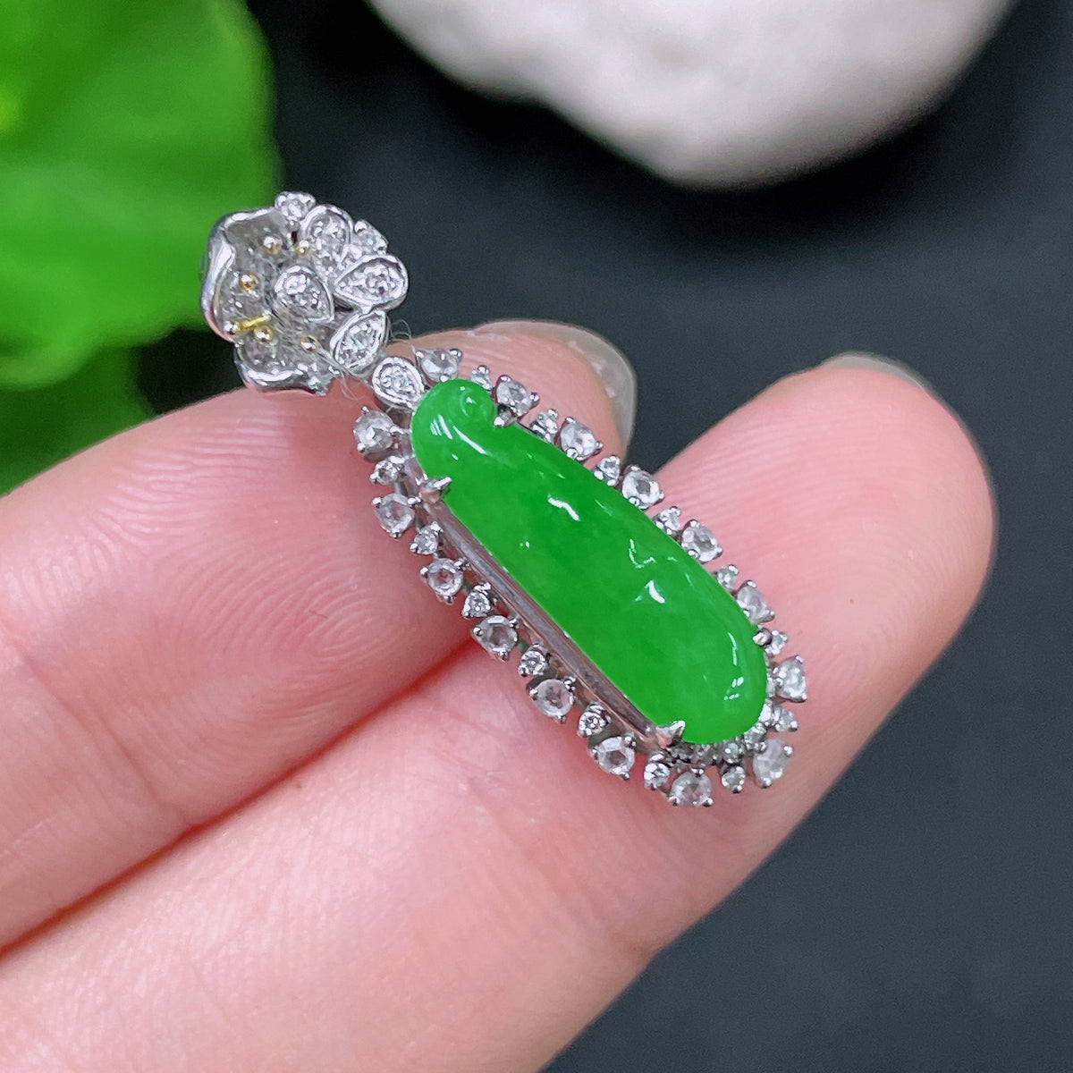 HUILIU HQ jadeite auspicious bean pendant with 18K gold setting and diamond accents, showcasing a smooth, polished jade stone.