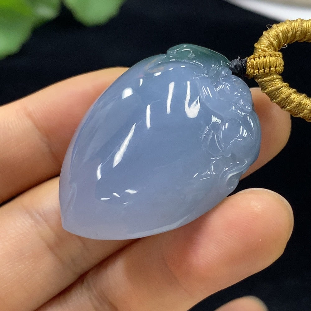 Jadeite "Auspicious Monkey Offering Longevity" pendant by HUILIU HQ, featuring a carved monkey design on smooth green jade.