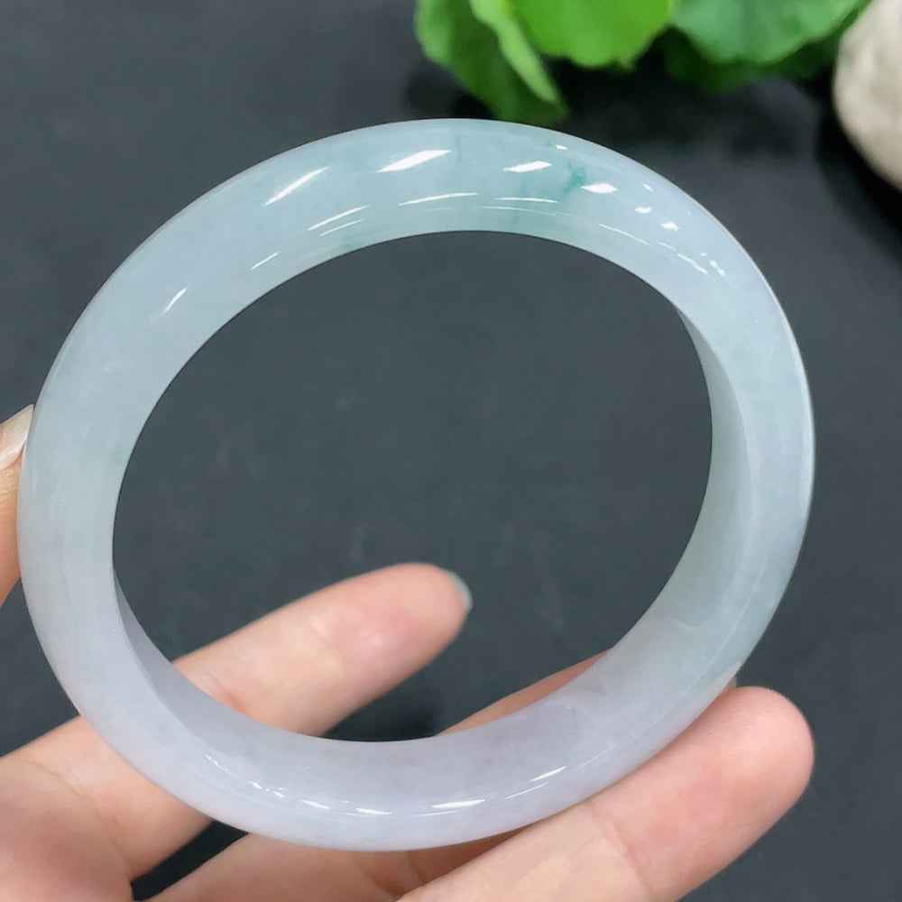 HUILIU HQ jadeite bangle in size 58.8mm, weighing 56.4g, featuring smooth, polished green jade with natural variations.