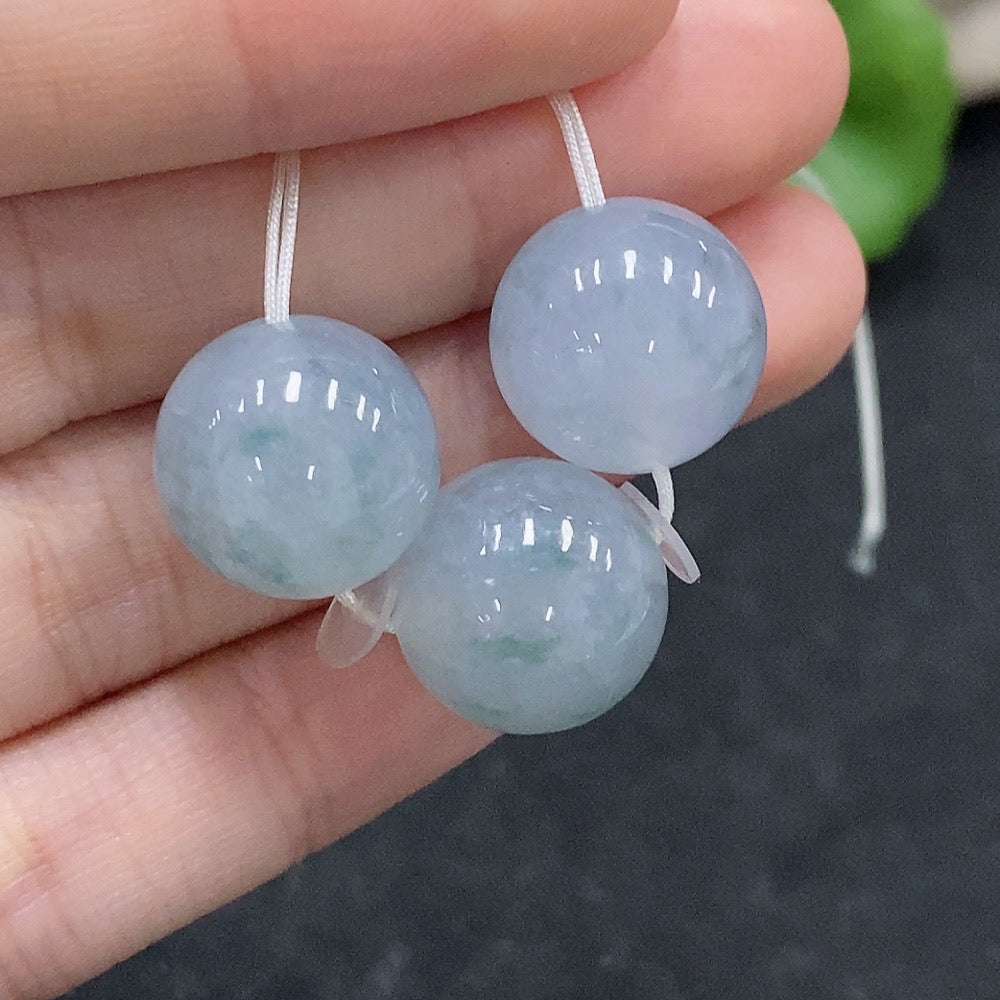 Huiliu Certified Jadeite Beads lot, showcasing smooth, green jade beads with natural variations, ideal for jewelry making.