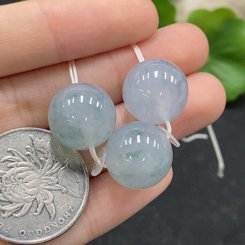 Huiliu-certified jadeite beads lot featuring smooth, green jade beads arranged in a natural string for jewelry making or collection.