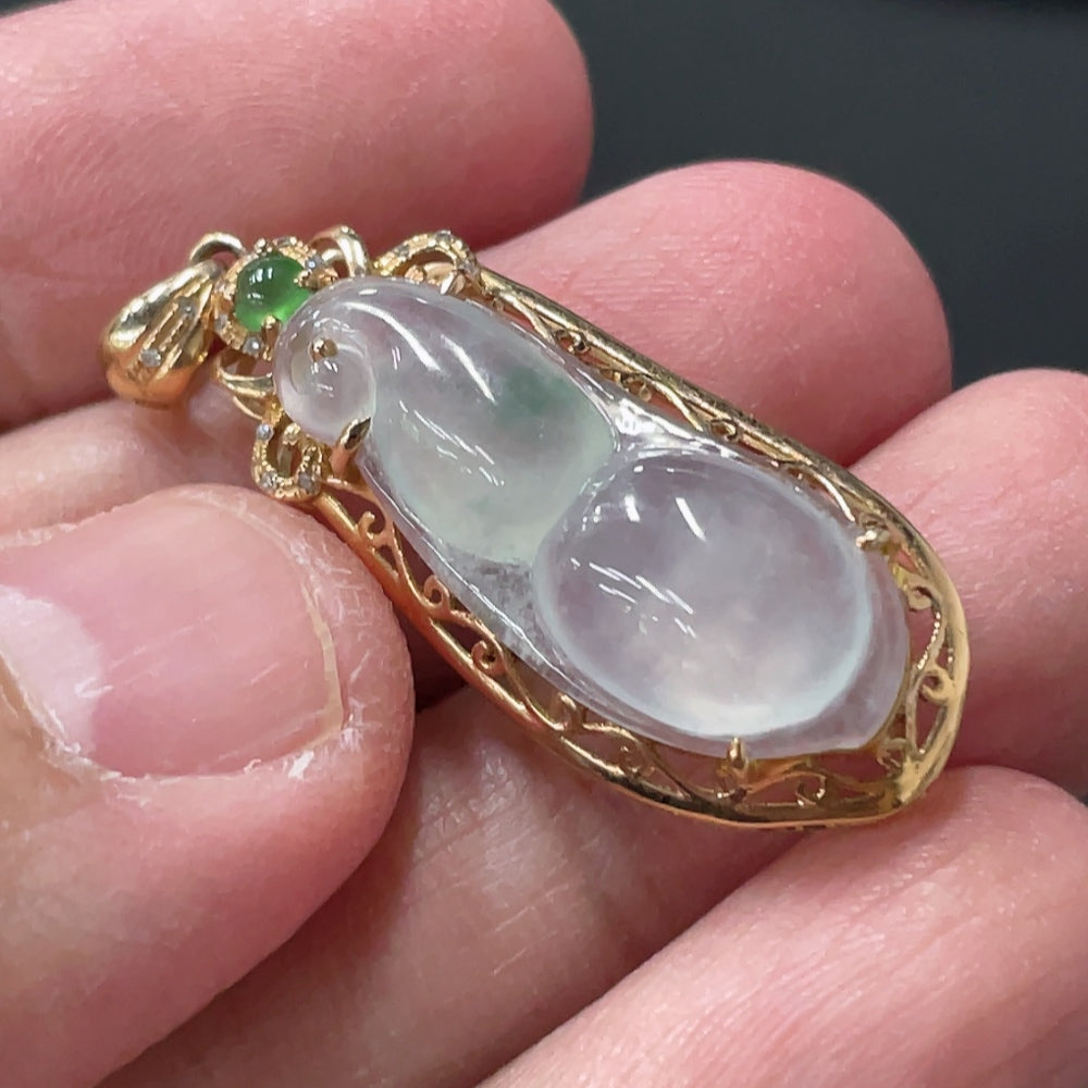 Jadeite blessed bean pendant with 18K gold and diamond accents, crafted by HUILIU HQ, weighs approximately 2.46g.
