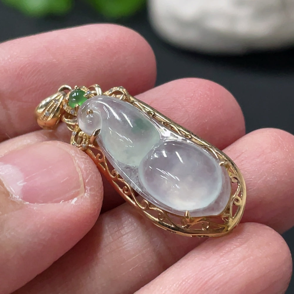 Jadeite blessed bean pendant by HUILIU HQ with 18K gold accents and diamond details, weighs approximately 2.46 grams.