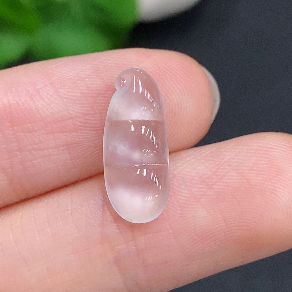 Jadeite Blessing Bean Pendant in green jade with smooth, polished surface, suspended on a delicate cord.
