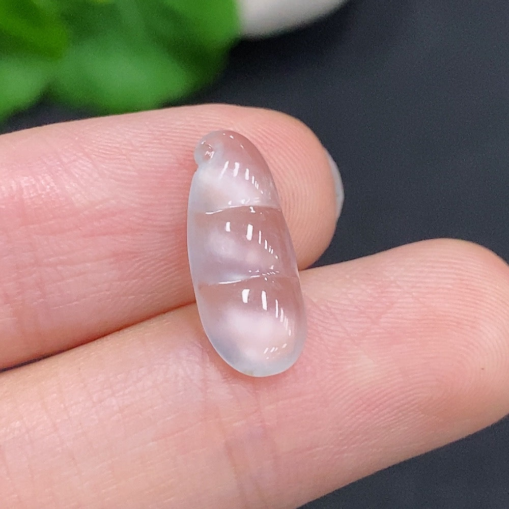 HUILIU HQ jadeite blessing bean pendant featuring a smooth, polished jade stone with carved details, hanging from a delicate cord.