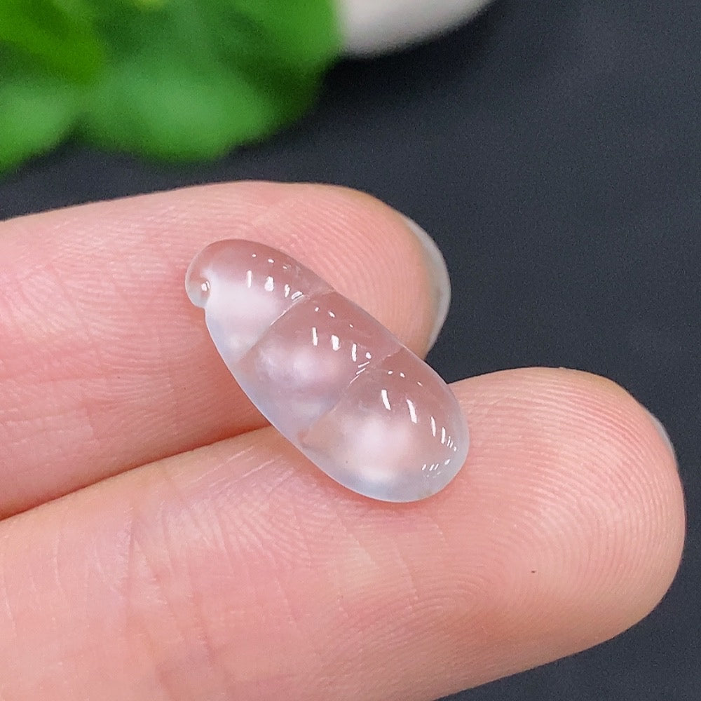 HUILIU HQ jadeite blessing bean pendant featuring a smooth, polished green jade stone with intricate carvings on a cord.