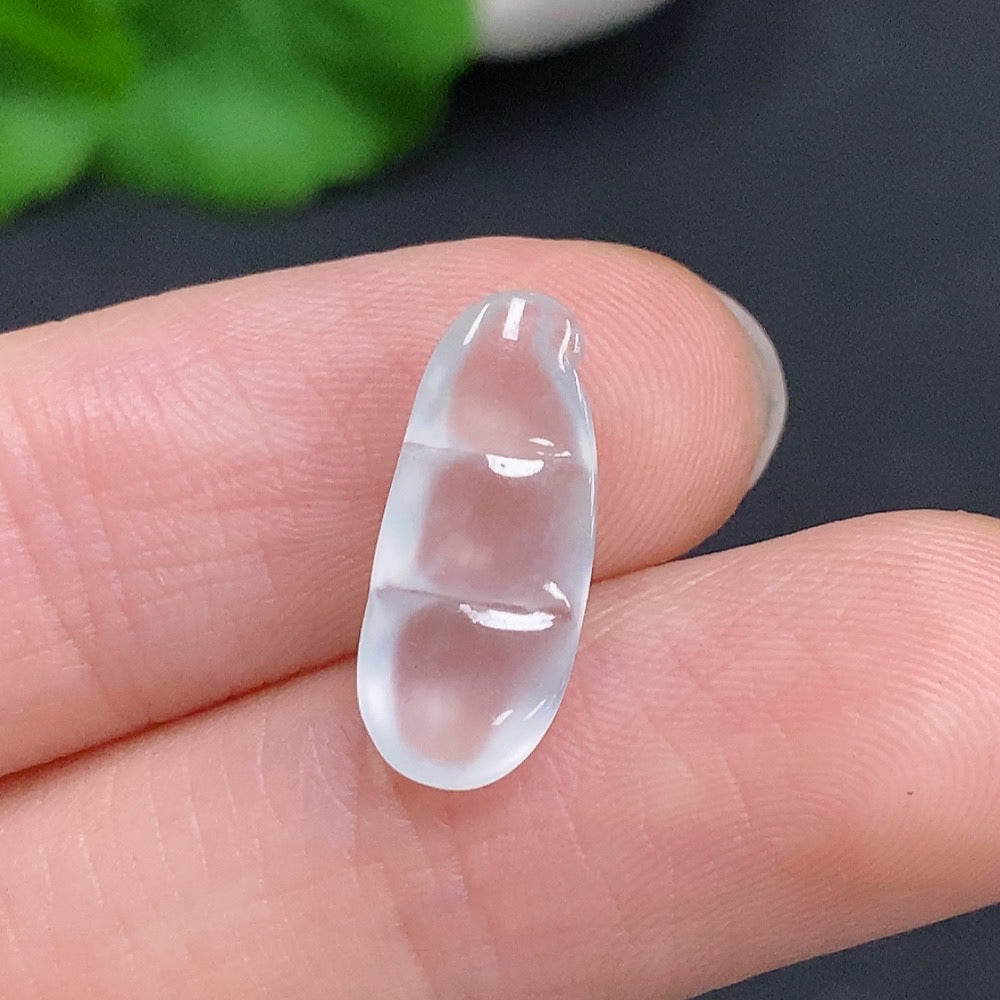 Jadeite Blessing Bean Pendant in green jade, crafted by HUILIU HQ, featuring a smooth, polished bean shape with intricate carvings.