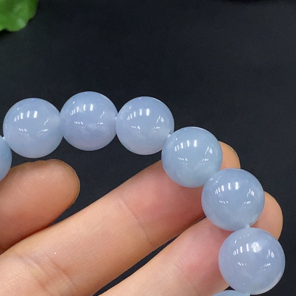 HUILIU HQ jadeite bracelet with 12.3mm beads, totaling about 47.94g, showcasing polished green jade stones.