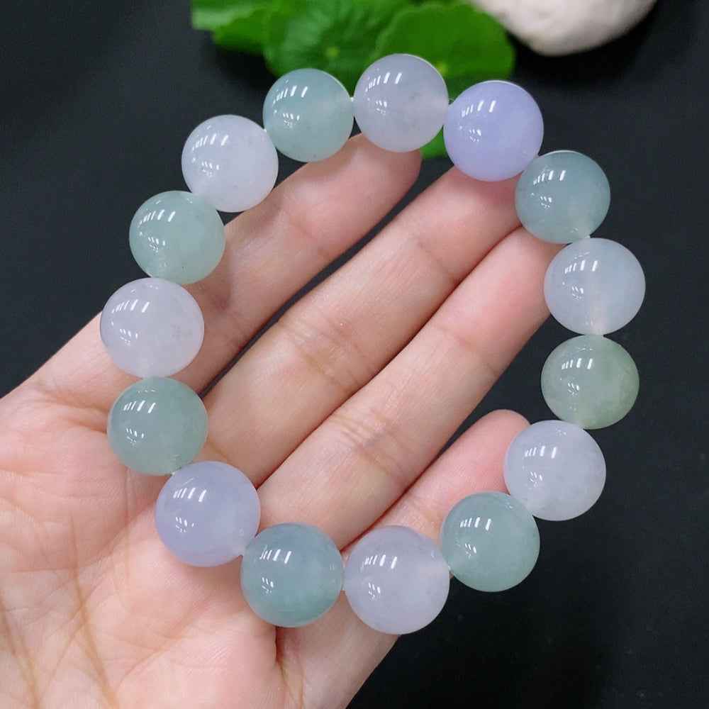 HUILIU HQ jadeite bracelet with 12.4-12.8mm beads, approximately 54.7g, showcasing smooth, polished jade stones on a string.