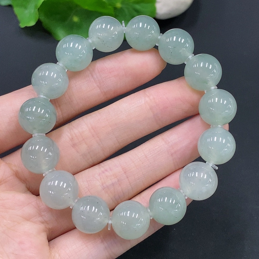 HUILIU HQ jadeite bracelet with 12.5mm beads, showcasing smooth, polished green jade stones on a white background.