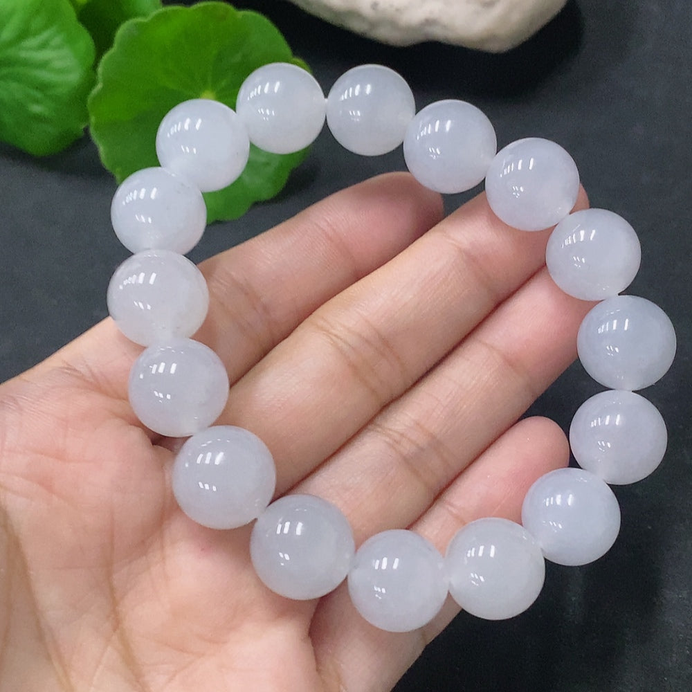 HUILIU HQ jadeite bracelet with 12.5mm beads and 51.96g weight, featuring smooth, polished jade stones on a string.