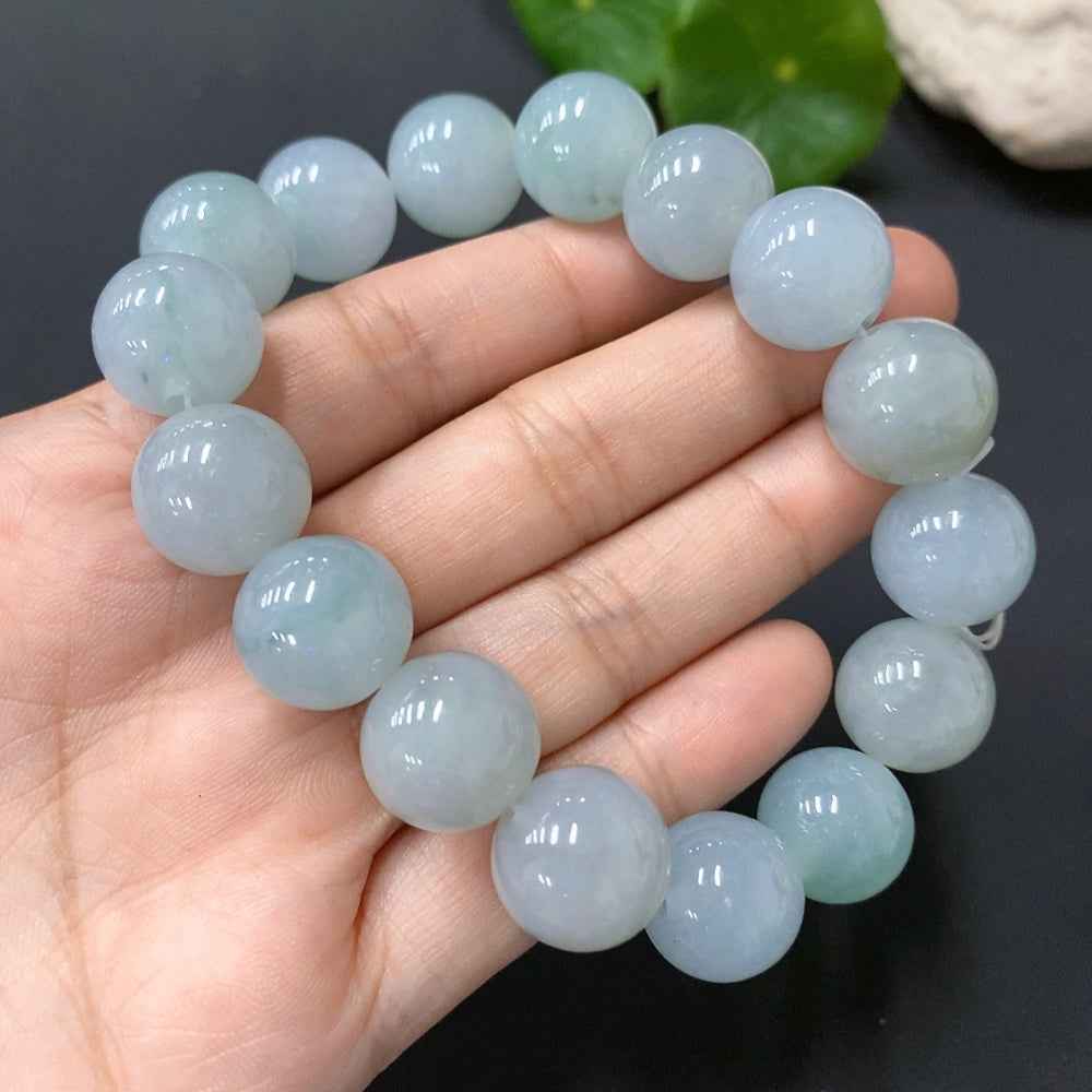 HUILIU HQ jadeite bracelet with 13.3mm beads, weighing 66.244g, showcasing smooth, polished jade stones on a neutral background.