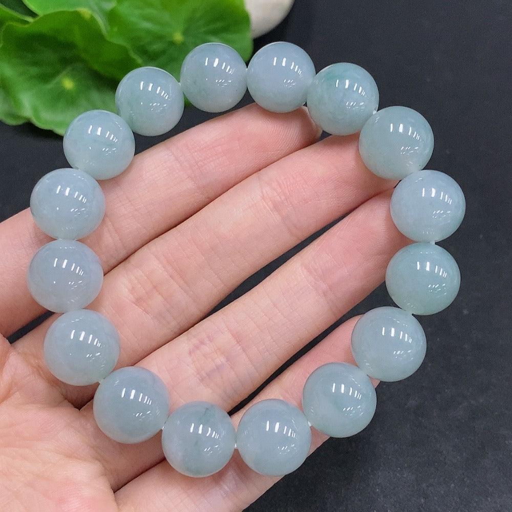HUILIU HQ jadeite bracelet weighing 52.1g with 12.3mm beads, showcasing smooth, polished jade stones.