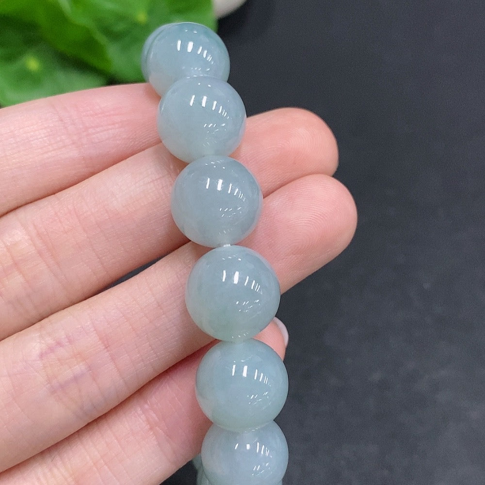 HUILIU HQ Jadeite bracelet weighing approx. 52.1g with 12.3mm size, featuring smooth, polished jade stones.