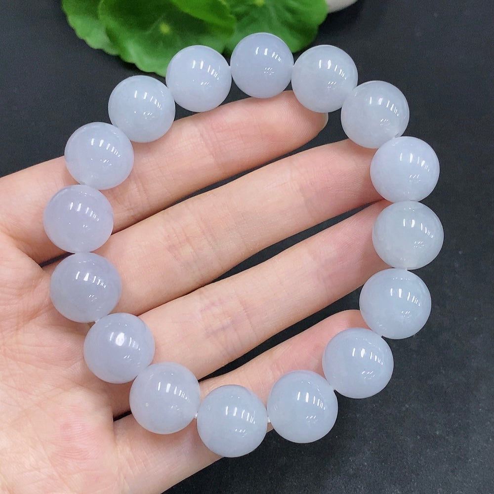 HUILIU HQ jadeite bracelet weighing 67.4g with 13.3mm stones, showcasing smooth, polished jadeite beads on a white background.