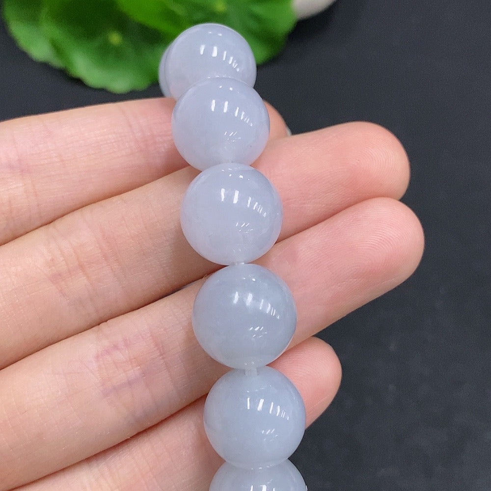 HUILIU HQ jadeite bracelet weighing 67.4g with 13.3mm jade stones, showcasing a smooth, polished jade jewelry piece.