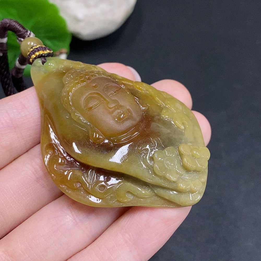 Jadeite Buddha flower pendant from HUILIU HQ, featuring a carved jade Buddha and floral design on a polished jade pendant.