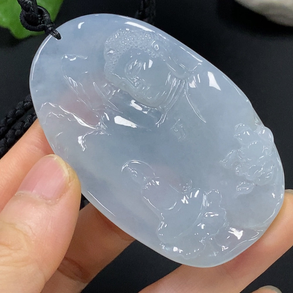 Jadeite Buddha pendant by HUILIU HQ showing a detailed Buddha observing the world in green jade with intricate carvings.