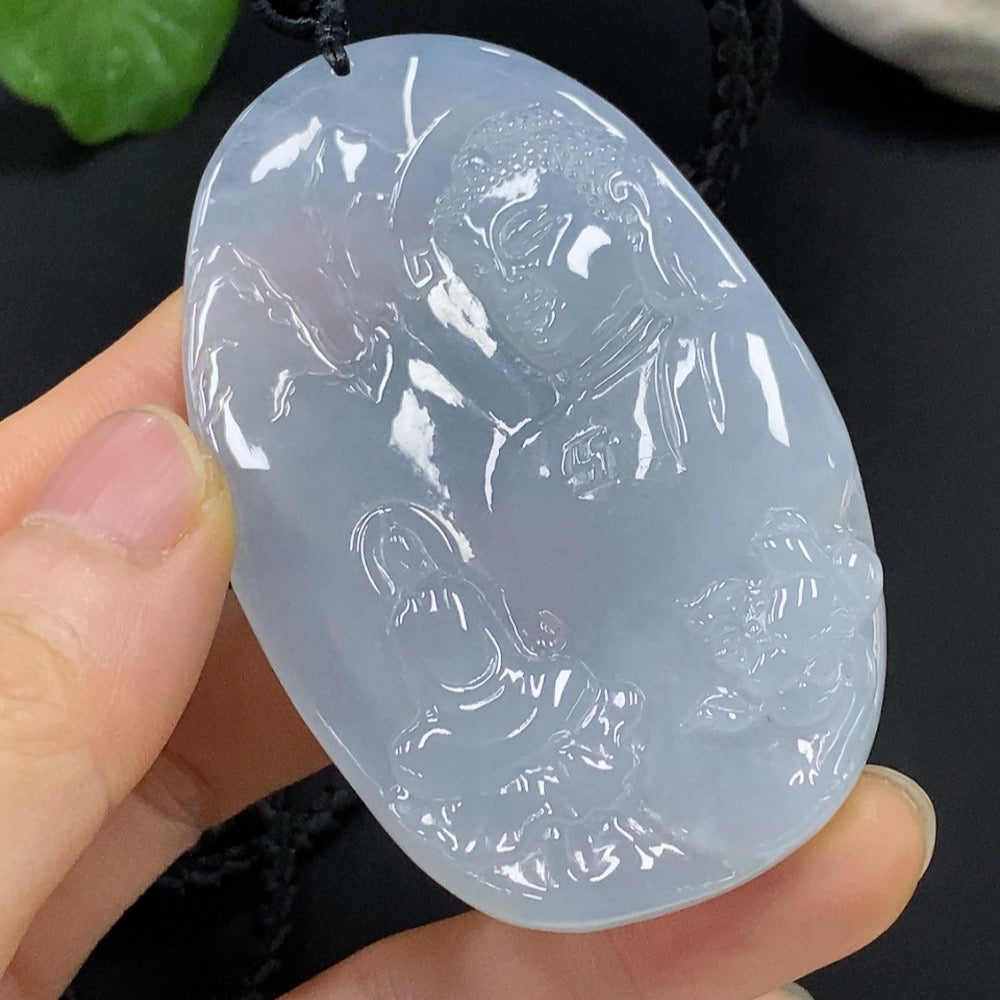 Jadeite Buddha pendant by HUILIU HQ featuring a Buddha observing the world, crafted from smooth jade with detailed carvings.
