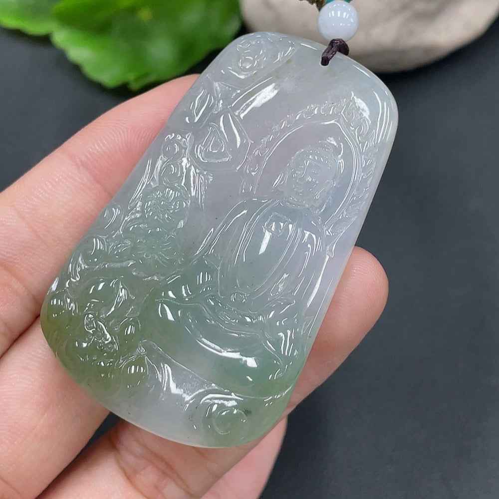 Jadeite Buddha pendant from HUILIU HQ, weighing 28.657g, featuring a detailed carved Buddha figure on smooth jade stone.