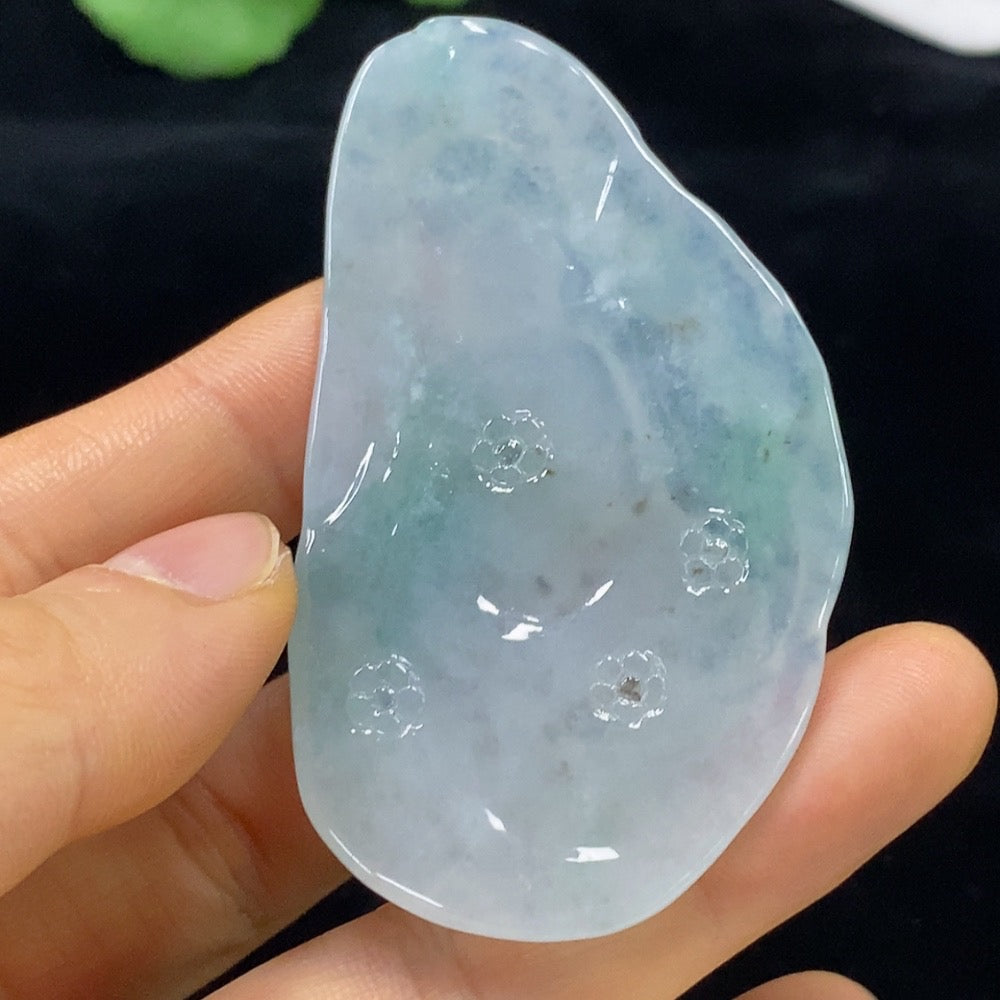 Jadeite Buddha pendant weighing approximately 30.19g, crafted from green jade, by HUILIU HQ, resting on a neutral background.