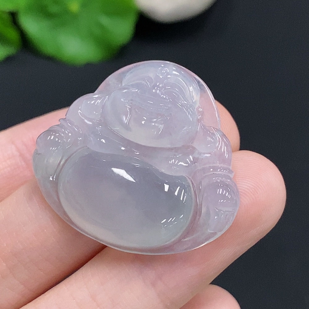 Jadeite Buddha pendant from HUILIU HQ showing a detailed carved Buddha figure on smooth green jadeite, weighing approximately 7.3g.