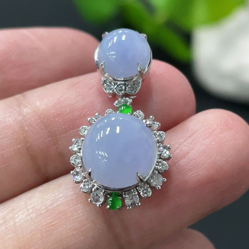Jadeite cabochon pendant with 18K gold setting and diamond accents, showcasing a smooth, polished jade stone with elegant gold and diamond details.
