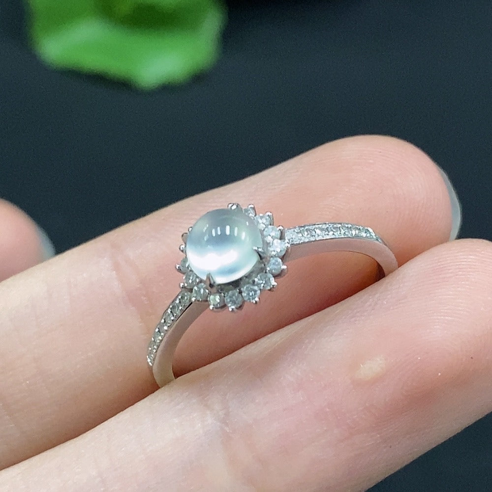 Jadeite cabochon ring by HUILIU HQ with 18K gold band, accented with small diamonds, size 14, weighs approx. 2.18g.