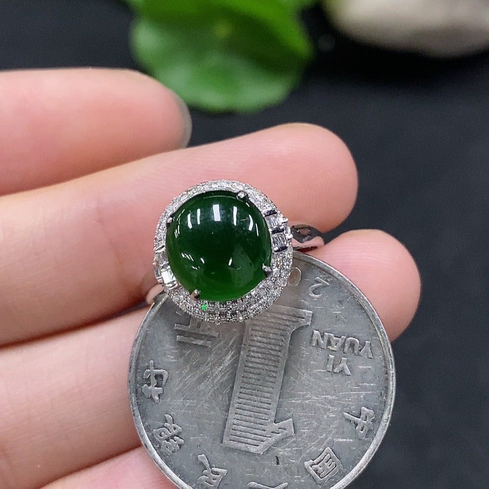 Huiliu certified jadeite cabochon ring with diamond accents, featuring smooth green jade and sparkling gemstone details.