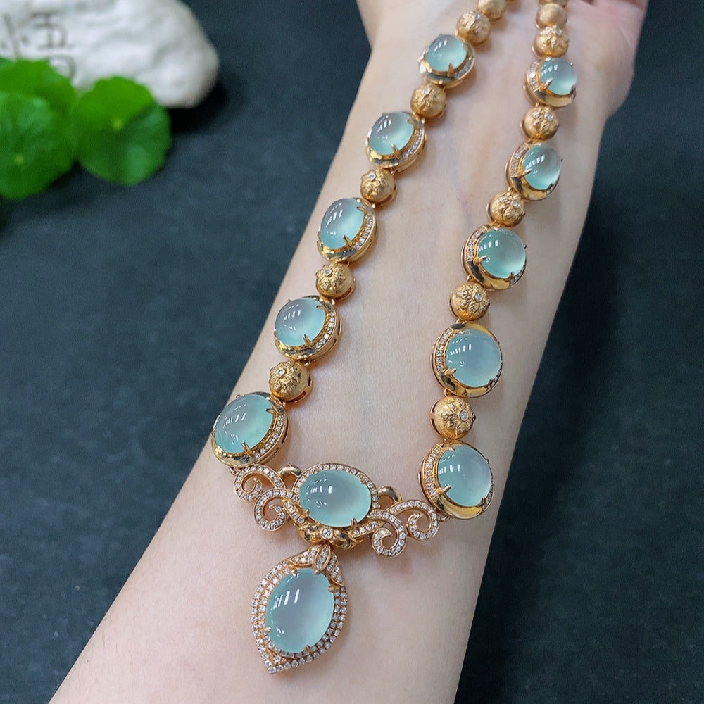 HUILIU HQ jadeite cabochon necklace with 18K gold and diamond accents, showcasing polished green jade stones.