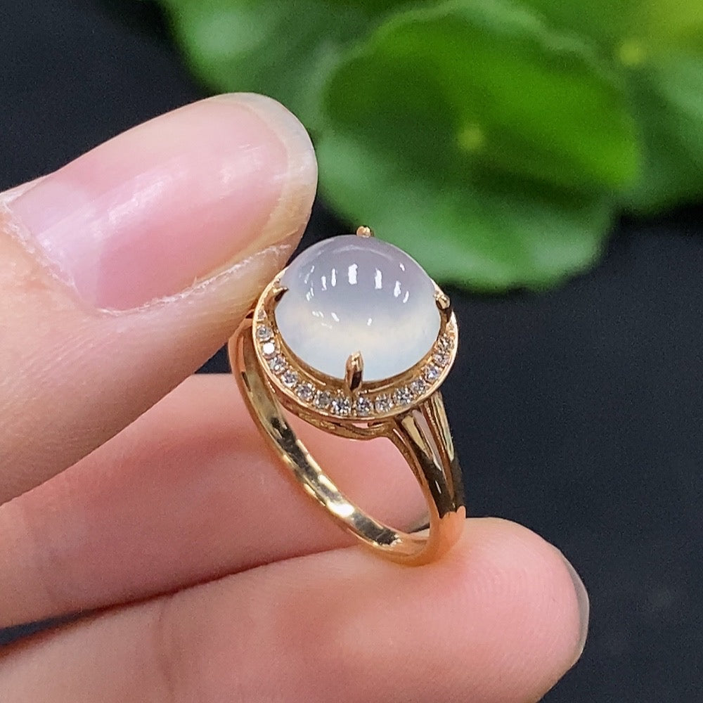 Huiliu certified jadeite cabochon solitaire ring with diamond accents, showcasing a smooth green jade gemstone and elegant silver setting.