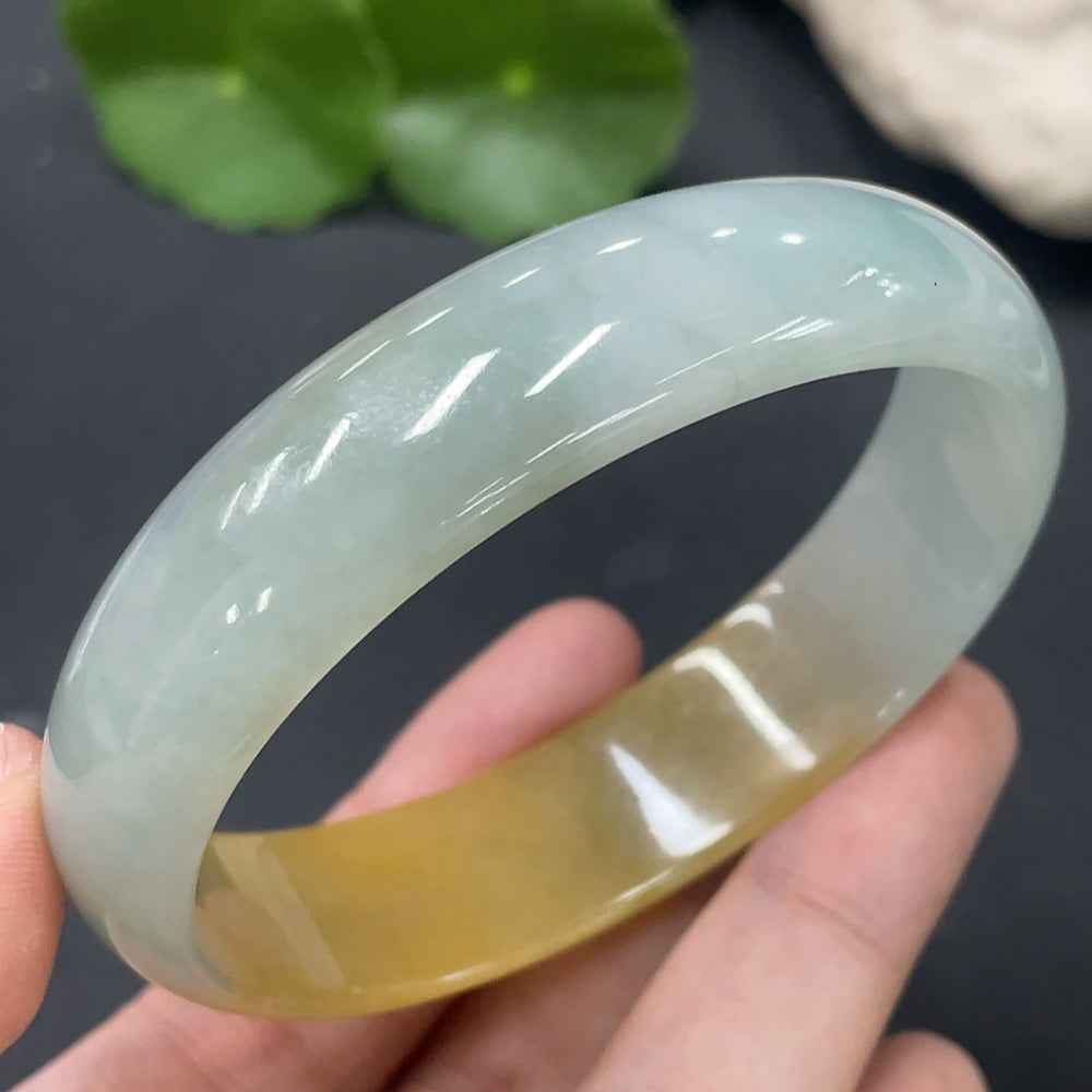 HUILIU HQ jadeite concubine bracelet with size 58.8/51mm, undetermined color, weighing 42.219g, showcasing smooth jade surface.