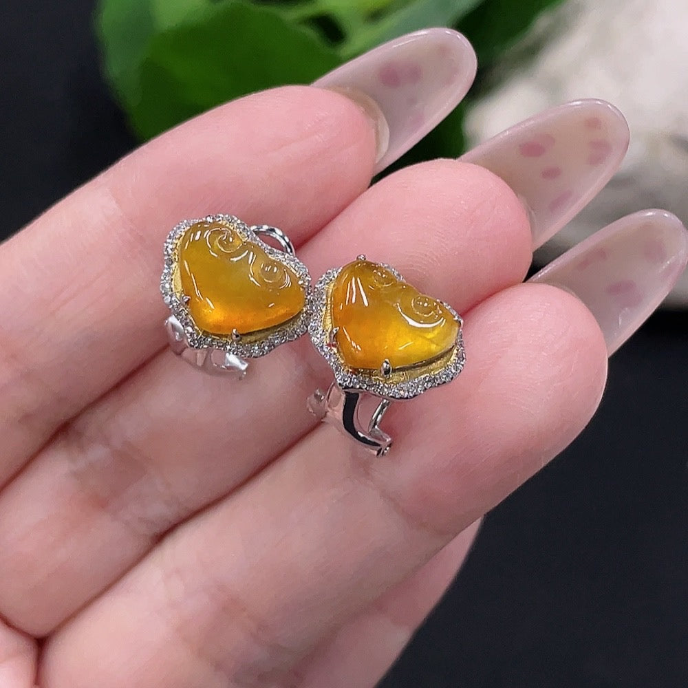 HUILIU HQ jadeite earrings pair with 18K gold and diamond accents, featuring polished green jade stones and delicate gold settings.
