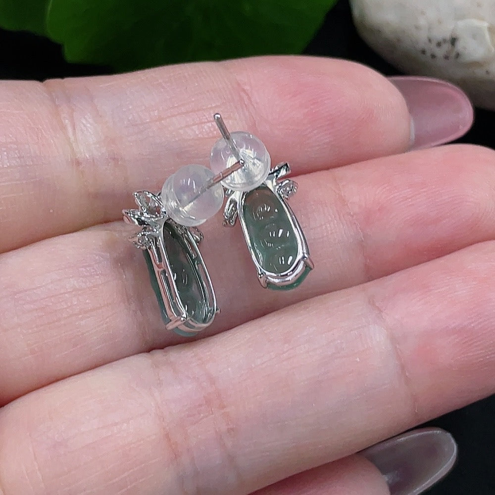 Huiliu certified jadeite earrings pair with two large jade stones and matching ear studs on a white background.