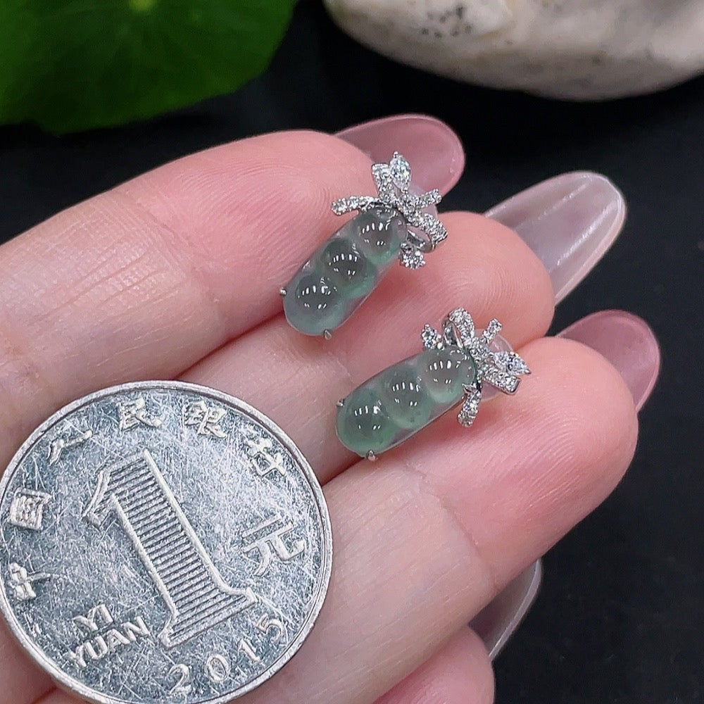 Huiliu Certified Jadeite earrings pair with large non-diamond stones and ear studs, showcasing elegant green jade jewelry.