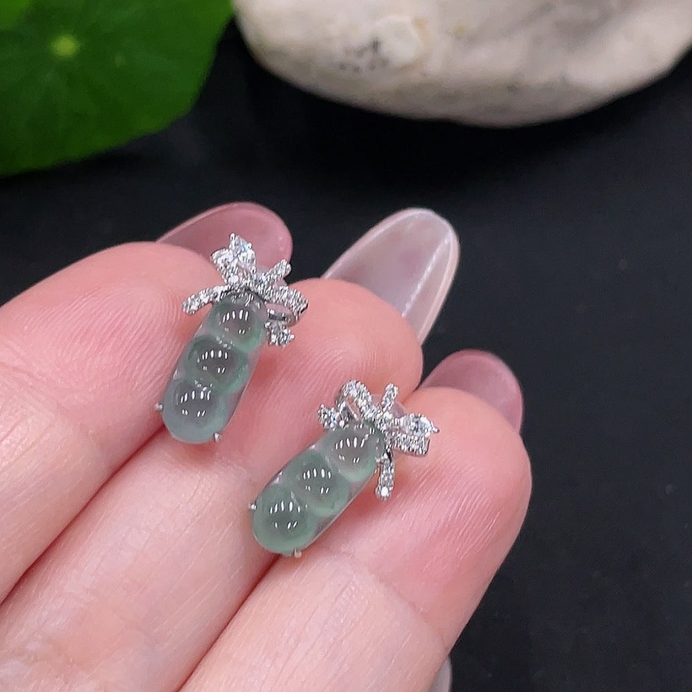 Huiliu certified jadeite earrings pair with large jade stones and ear studs, showcasing elegant natural jade jewelry.