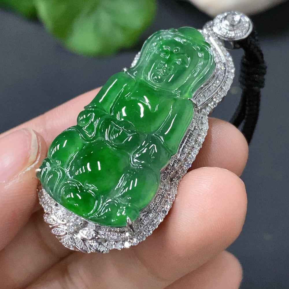 Jadeite Guanyin pendant with 18k gold inlay from HUILIU HQ, featuring a detailed carved figure and a cord for wearing.
