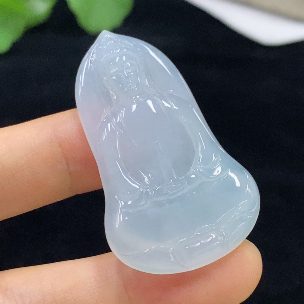Jadeite Guanyin pendant from HUILIU HQ showcasing detailed carved figure, weighs approximately 11.09g, made of smooth green jade.
